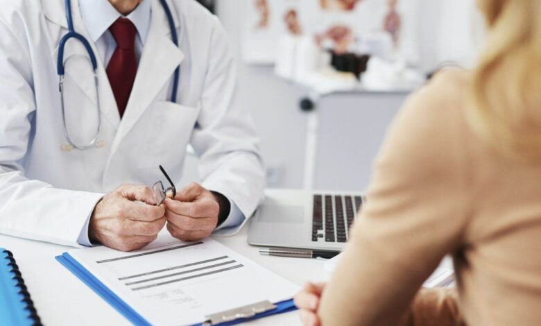 Close up of patient and doctor in doctor's office