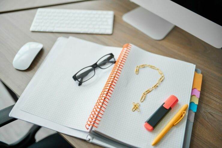 Notepad with a question mark, IT worker workplace