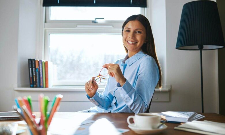 Smiling woman at desk in home office