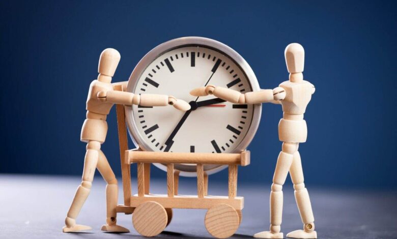 Wooden fugures with clock