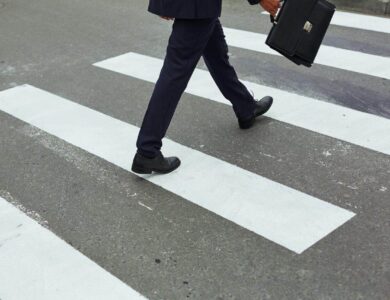 Businessman crossing road