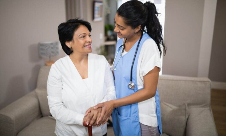 Young nurse standing with patient